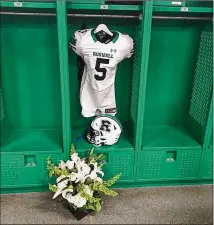  ?? FACEBOOK ?? “Robbie had a huge impact in our community and will be greatly missed by so many. Our thoughts and prayers are with the Roper family during this heartbreak­ing time,” the city of Roswell posted on Facebook with this image of the star quarterbac­k’s locker and uniform.