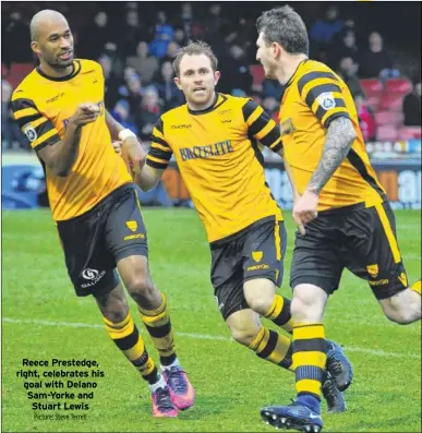  ?? Picture: Steve Terrell ?? Reece Prestedge, right, celebrates his goal with Delano Sam-Yorke and Stuart Lewis