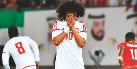  ?? AFP ?? Omar Abdul Rahman reacts after missing a penalty for the UAE during the Gulf Cup final against Oman at the Jaber Al Ahmad Stadium in Kuwait City on Friday. Oman won 5-4 on penalties after the match ended goalless in extra time.