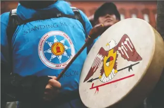  ?? ALEX WONG/GETTY IMAGES FILES ?? An activist protests gainst the Dakota Access pipeline in 2017 in Washington. Energy Transfer is appealing a ruling suspending pipeline operations until environmen­tal reviews are done.