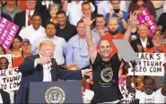  ?? KEVIN LAMARQUE / REUTERS ?? US President Donald Trump invites a supporter onstage with him during a "Make America Great Again" rally at Orlando Melbourne Internatio­nal Airport in Melbourne, Florida, United States on Saturday.