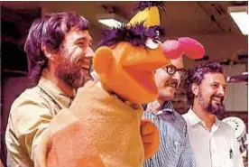  ?? SESAME WORKSHOP/HBO ?? ROBERT FUHRING Puppeteers Jim Henson (left) and Frank Oz (center) are shown with “Sesame Street” director/writer Jon Stone.