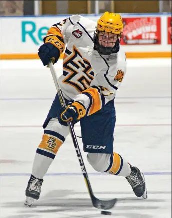  ?? STEVEN MAH/SOUTHWEST BOOSTER ?? Spencer Bell blasted a point shot on goal during last week’s comeback win over the Notre Dame Hounds on home ice.