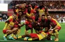  ?? ?? Lens players enjoy their 3-0 win over Ajaccio. Photograph: Stéphanie Lecocq/Reuters