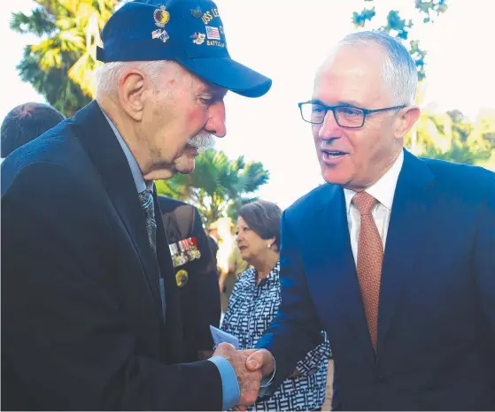  ??  ?? Battle of the Coral Sea survivor Cecil Wiswell with Prime Minister Malcolm Turnbull at yesterday’s ceremony. Picture: EVAN MORGAN