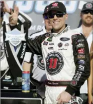  ?? RICK SCUTERI — THE ASSOCIATED PRESS ?? Monster Energy NASCAR Cup Series driver Kevin Harvick (4) holds up three fingers after winning his third race this season during the NASCAR Cup Series on Sunday in Avondale, Ariz.