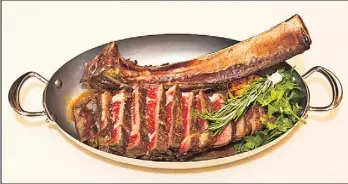  ??  ?? The 44-ounce “tomahawk” rib-eye steak at Costata is among the very best in New York.