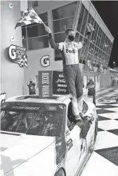  ?? LEE/AP
WILFREDO ?? Denny Hamlin celebrates after winning a NASCAR Cup Series race Sunday in Homestead, Fla.