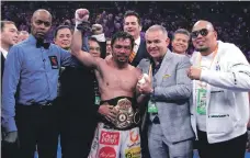  ?? AFP ?? Keith Thurman is knocked down by Manny Pacquiao, top, in the first round and, above, the Filipino celebrates his victory