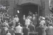  ?? FILE — THE ASSOCIATED PRESS ?? President John F. Kennedy and first lady Jacqueline Kennedy leave St. Mary’s Church in Newport, R.I., after Mass in 1961.