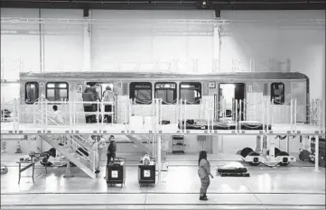  ?? ABEL URIBE/CHICAGO TRIBUNE ?? One of the prototype rail cars being assembled at the CRRC plant in Hegewisch on June 13.