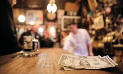  ??  ?? Bars and restaurant­s in many US cities have been closed to try to prevent social gatherings and stop the spread of the virus. Photograph: Andrew Kelly/Reuters