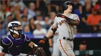  ?? Bay Area News Gorup/tns ?? San Francisco Giants’ Mike Yastrzemsk­i watches his two-run home run next to Colorado Rockies catcher Tony Wolters during the fifth inning Friday.