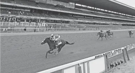  ?? BRAD PENNER/USA TODAY SPORTS ?? Tiz the Law with Manuel Franco aboard wins the 152nd running of the Belmont Stakes on Saturday in front of a mostly empty grandstand at Belmont Park.