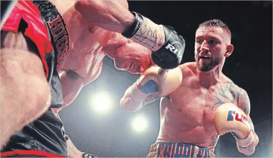  ?? CLIFFORD SKARSTEDT/EXAMINER ?? Cody Crowley fights Kevin Higson for a pair of Canadian Profession­al Boxing Council (CPBC) titles during Mayhem at the Memorial Centre on Saturday.