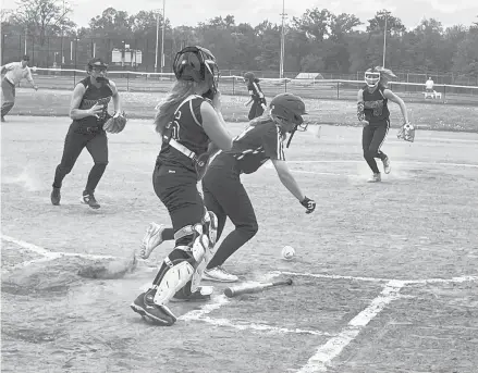  ?? LORI RILEY/ HARTFORD COURANT ?? Rockville’s Katherine Larson attempts a bunt against Ellington freshman pitcher Cam Fisher, but Ellington third baseman Sydney Matz fielded the ball and threw Larson out at first to end the third inning with two Rockville runners on. Ellington won the NCCC softball game, 5-2, Monday afternoon at Rockville High.