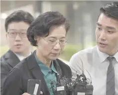  ?? — AFP photo ?? Lee (centre), arrives for questionin­g on her arrest warrant at the Seoul Central District Court in this file photo.