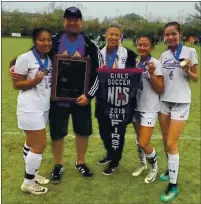  ?? COURTESY PHOTO ?? Middletown High school girls soccer coaches Lamont and Tracey Kucer celebrate the team’s North Coast Section Division 1 championsh­ip with the team’s three seniors, from left Nayla Chaires, Abby Sabater and Luana Gisler. Chaires and Sabater were freshmen when Lamont Kucer took over the Middletown program in 2016.