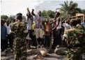  ?? PICTURE: AP ?? SPEAKING OUT: Opposition party protesters confront soldiers in Mutarakura district in the capital, Bujumbura.