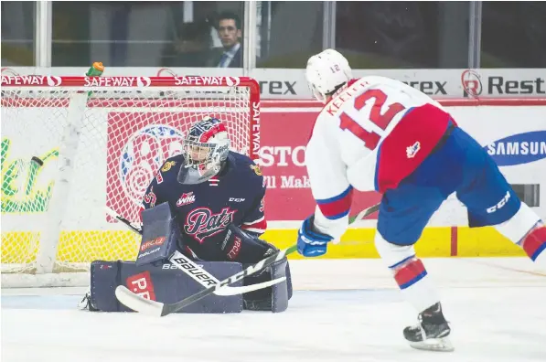  ?? — BRANDON HARDER ?? Liam Keller of the Edmonton Oil Kings scores a breakaway goal against Regina Pats netminder Max Paddock on Tuesday at the Brandt Centre. Edmonton won 5-3 to extend the Pats’ losing streak to seven games.