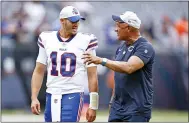  ?? KAMIL KRZACZYNSK­I — THE ASSOCIATED PRESS ?? Buffalo Bills quarterbac­k Mitchell Trubisky (10) chats with Chicago Bears offensive line coach Juan Castillo, right, after a preseason NFL football game, Saturday, Aug. 21, 2021, in Chicago.