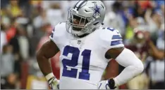  ?? AP PHOTO/PATRICK SEMANSKY ?? Dallas Cowboys running back Ezekiel Elliott celebrates his touchdown during the first half of an NFL football game against the Washington Redskinsin Landover, Md., on Sunday.