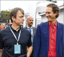  ?? LARS BARON / GETTY IMAGES ?? Fiat Chrysler CEO Michael Manley (left) talks to Ferrari Chairman John Elkann last week before the Formula One Grand Prix of Italy in Monza, Italy. Manley said FCA’s new self-driving testing site is a key part of its five-year autonomous-vehicle plan.