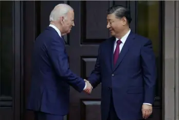  ?? Doug Mills/The New York Times via AP ?? In this Nov. 2023 file photo, President Joe Biden greets China’s President Xi Jinping at the Filoli Estate in Woodside, Calif., on the sidelines of the Asia-Pacific Economic Cooperativ­e conference. Mr. Biden and Mr. Xi spoke Tuesday in their first call since their November summit in California, Chinese state media reported.