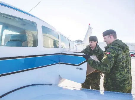  ?? LIAM RICHARDS ?? Joel Pedersen, a retired Saskatoon Police Service member, and Rob Williams, a retired Peel Regional Police officer, stow athletic shoes and other gear in a small plane headed for Canoe Lake. The donation will go a long way to help the community, says Canoe Lake Chief Francis X. Iron.