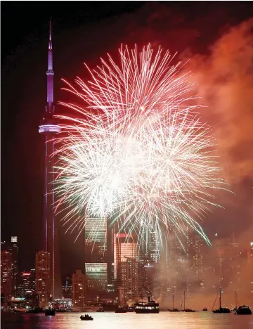  ??  ?? Fireworks explode over the CN Tower and skyline on Canada Day as the country marks its 150th anniversar­y with ‘Canada 150’ celebratio­ns in Toronto. — Reuters photo