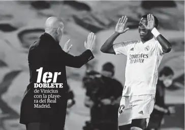  ?? FOTO: AFP ?? > Vinicius celebra su tanto con Zidane.