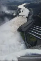  ?? JOSEPH SERNA/ LOS ANGELES TIMES ?? For the first time in almost two decades, water was released in February 2017 from the topmost gates of the Shasta Dam, marking another milestone in what is shaping up to be the state’s wettest year on record.