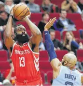  ?? Brett Coomer / Staff photograph­er ?? Rockets guard James Harden was more than Jevon Carter and the Grizzlies could handle Monday night.