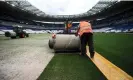  ?? AFP/Getty Images ?? Workers install a new pitch at Stade de France this week. The job was finished at 1am on Friday. Photograph: Franck Fife/