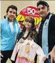  ?? TAYLOR CAMPBELL ?? Victoria Paige Meyerink, a former child actress who co-starred with Elvis in the 1968 film Speedway, stands with tribute artists Pete Doiron, left, and Norm Ackland Jr. at the Hellenic Cultural Centre for the 12th annual Kingfest. Meyerink is holding the dress she wore in the film when she was six years old.