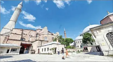  ?? AFP ?? Tourists depart Hagia Sophia, a UNESCO World Heritage site.