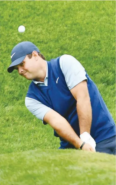  ?? Reuters ?? ↑ Patrick Reed chips on the ninth hole during the final round of The Players Championsh­ip golf tournament in Florida on Sunday.