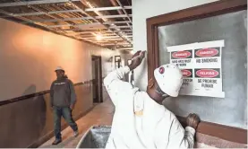  ?? THE COMMERCIAL APPEAL ?? Workers are busy inside the Universal Life Insurance building. Self+Tucker Architects and the City of Memphis Business Developmen­t Center are expected to move into 480 Dr. Martin Luther King Blvd. this spring. BRAD VEST /