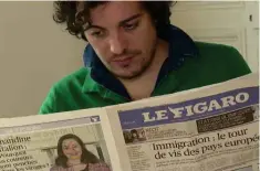  ?? ?? This image grab taken from video footage on Dec 26, 2023 shows French actor and columnist for French conservati­ve magazine Causeur Yannis Ezziadi reading French newspaper Le Figaro during an interview in Paris.