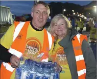  ??  ?? Kieran and Tracy O’Brien handing out water.