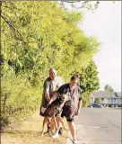  ?? Yehyun Kim / CTMirror.org ?? Justin Bidwell, left, and Misty Bidwell with their dog Draven in Southingto­n on Aug. 31. They have been living in a motel since May 2019 and pay more than $300 a week.