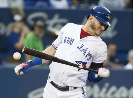  ?? CARLOS OSORIO/TORONTO STAR ?? Josh Donaldson is hit by a pitch in the third inning of Toronto’s 3-2 win over Tampa Bay. Donaldson also had two hits and is now hitting .383 in August.