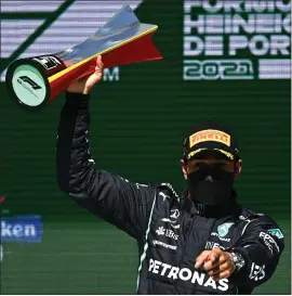  ??  ?? Lewis Hamilton saw off rival Max Verstappen to claim the Portuguese Grand Prix title in the Algarve on Sunday