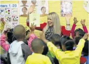  ?? Picture: ESA ALEXANDER ?? KIDS’ STUFF: Robyn Brown shares a story with children at the Wavecrest Educare Centre