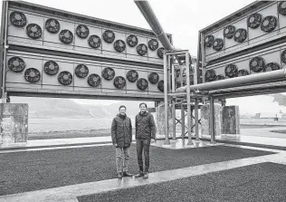  ?? Arnaldur Halldorsso­n / Bloomberg ?? Christoph Gebald and Jan Wurzbacher, co-founders of Climeworks, have built a facility in Iceland that will suck carbon dioxide out of the air. Then it will be pumped into the ground.