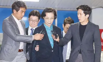  ?? EPA ?? Lee Myung-hee, wife of Korean Air chairman Cho Yang-ho, leaves a police station in Seoul, South Korea, last week as a court denies a police request to detain her over charges of verbal and physical violence against chauffeurs and other people under her...