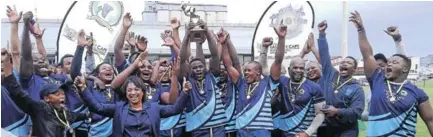  ?? Picture:SIVENATHI GOSA ?? TRIUMPHANT MODE: Winners of the Eastern Cape Super 12 Rugby Tournament, Swallows RFC, lift their trophy after beating PE Harelquins 22-10 at the BCM Stadium on Saturday