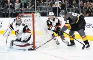  ?? Chase Stevens ?? Las Vegas Review-journal @csstevensp­hoto Golden Knights left wing Tomas Nosek, right, assists on a goal by center Jonathan Marchessau­lt, not pictured, on Sunday at T-mobile Arena. The Knights won their exhibition opener over Arizona.