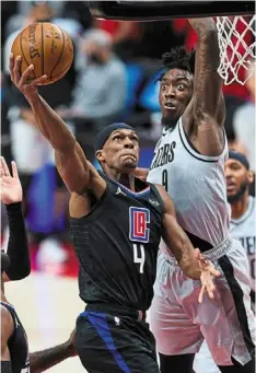  ?? — reuters ?? On course: la Clippers guard rajon rondo (4) shoots over portland Trail Blazers forward Nassir little during their NBa game.