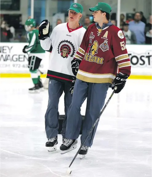  ?? — GETTY IMAGES ?? NHL Draft prospects Rasmus Dahlin of Sweden, left, and Noah Dobson of Canada participat­e in the Top Prospects Youth Hockey Clinic ahead of the 2018 NHL Draft at the Dr. Pepper StarCenter on Thursday in Dallas.